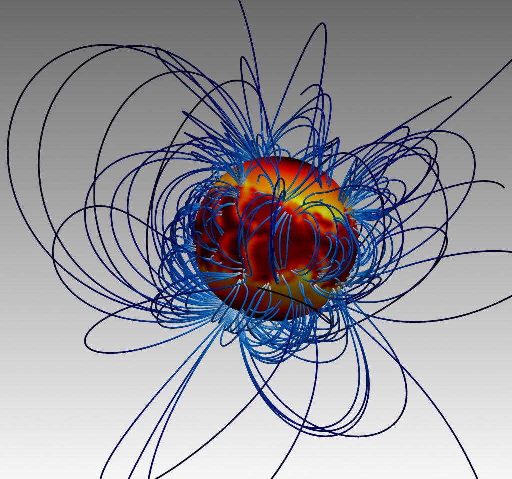 Neutron star with hot and cold spots at the surface and external magnetic field 